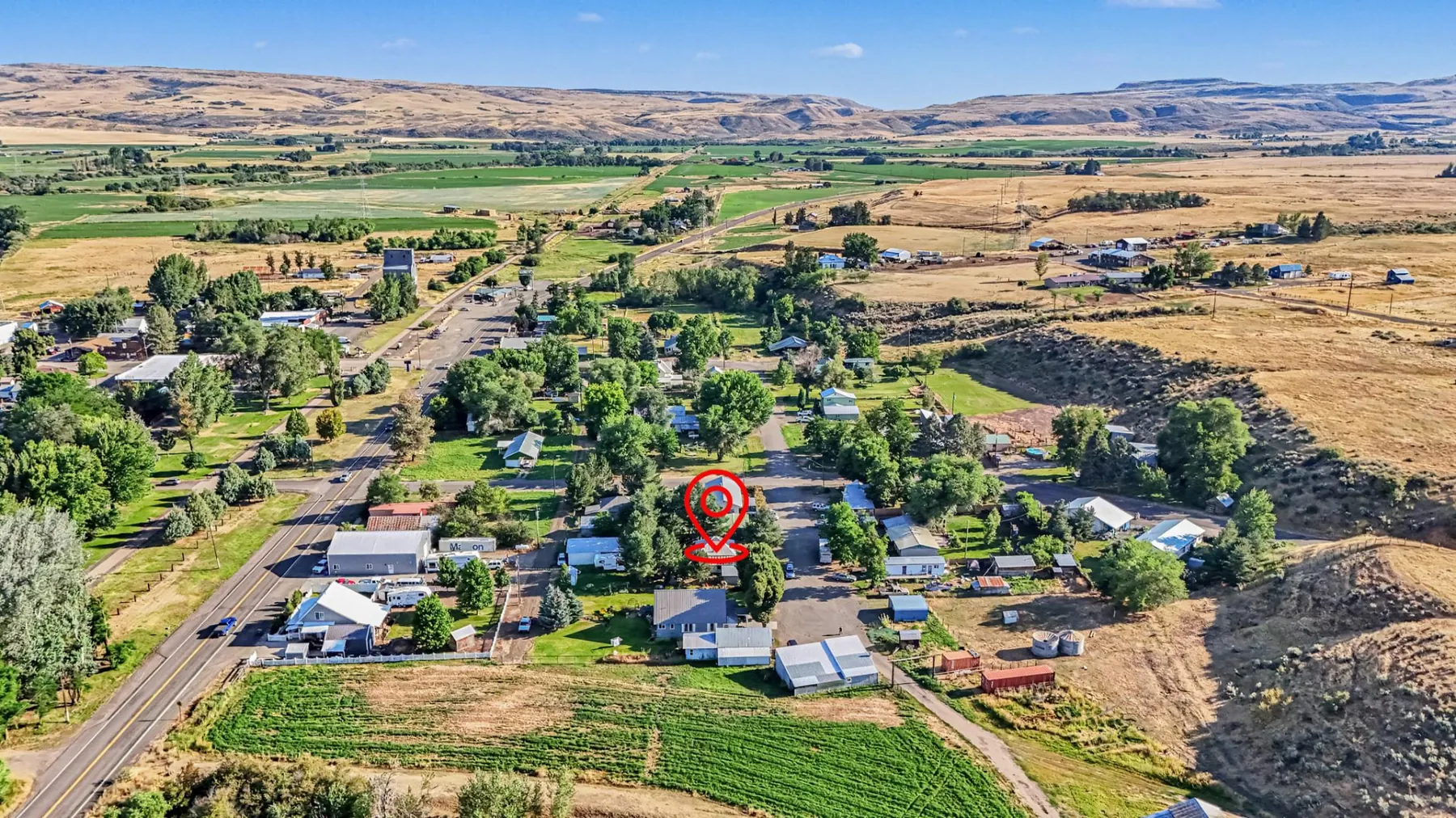 Aerial view of Midvale, Idaho showing the property location among tree-lined streets and surrounding farmland