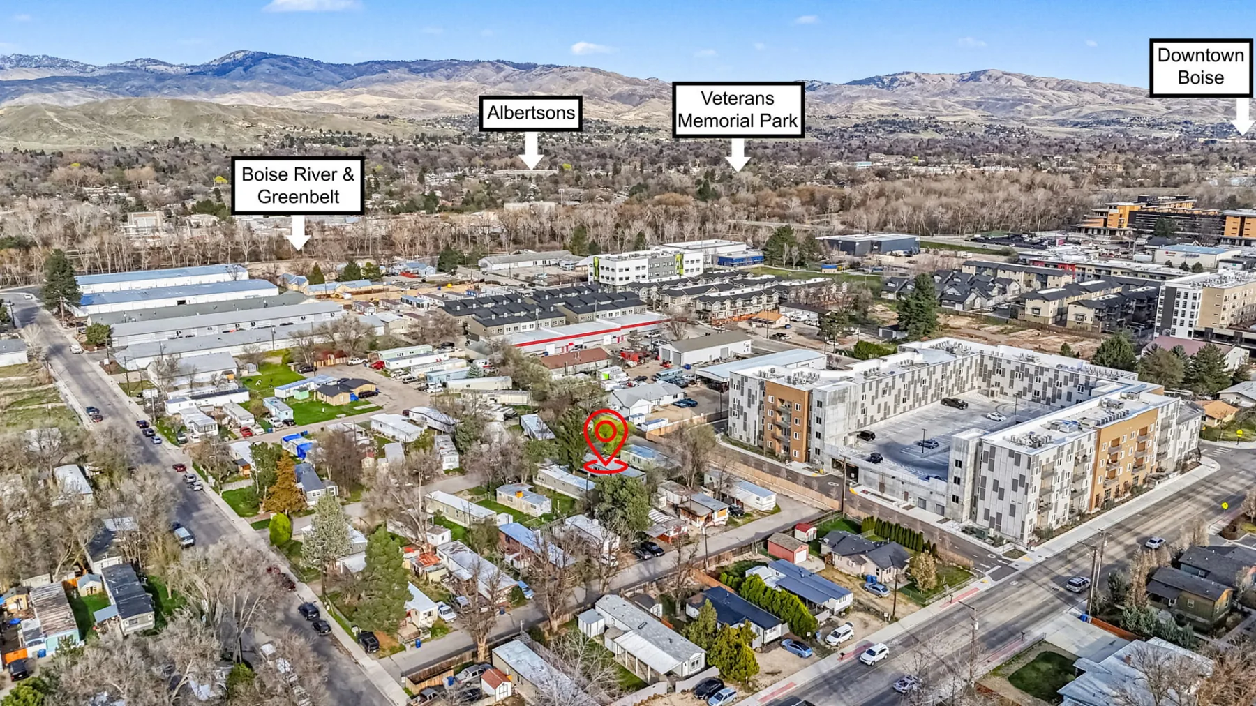 Aerial view looking toward the Boise foothills, with a marker showing the location of the home