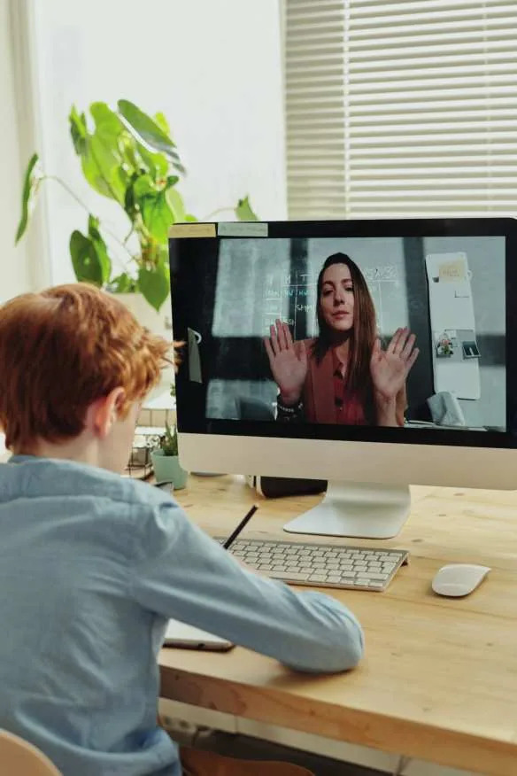 Person working remotely from a home office on a video call