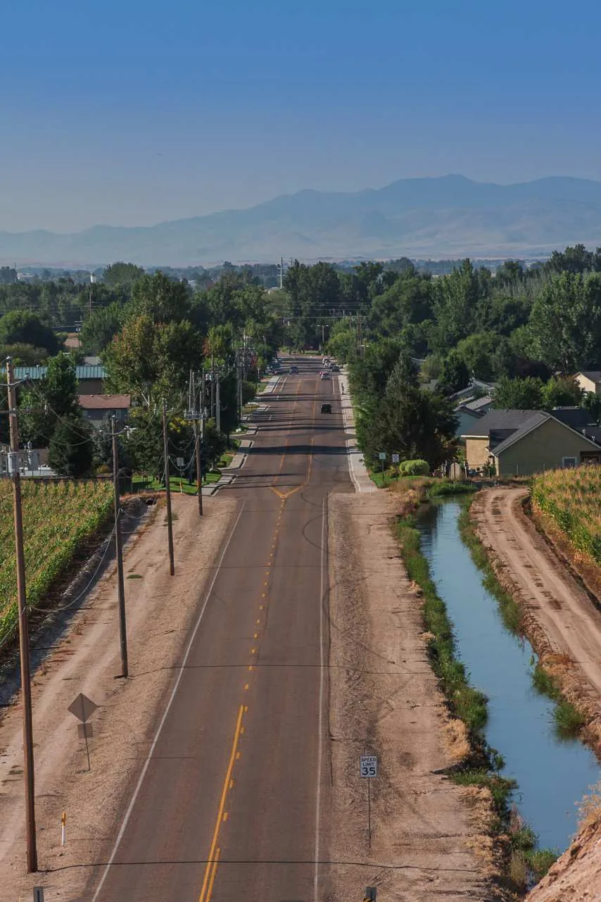 Country road running alongside a canal in Middleton, Idaho