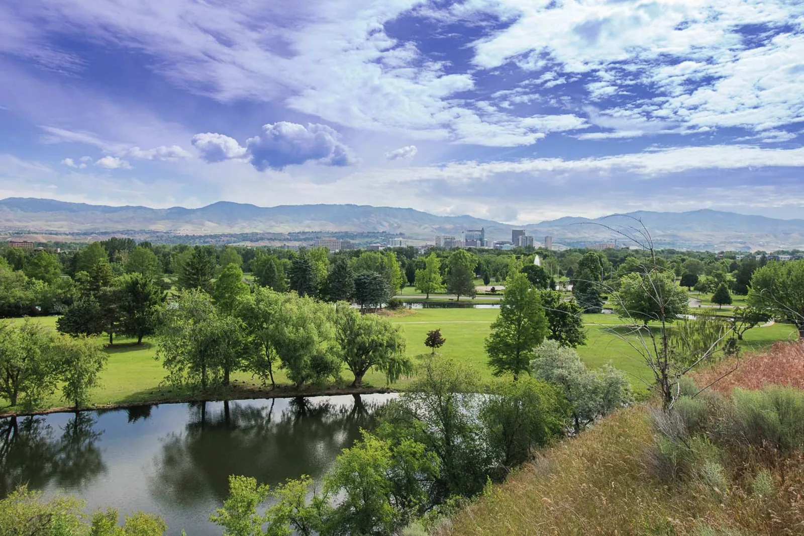 Green park and pond along the Boise River corridor in Boise, Idaho